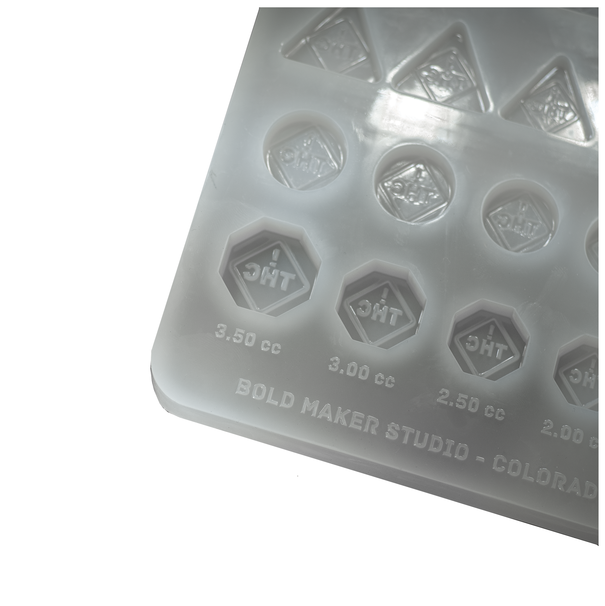 ColoradoTHCSymbolCandyGummyMoldResearchandDevelopmentSampleKitColoradoOhioFlorida100PercentPlatinumSiliconeCornerWhiteBackground
