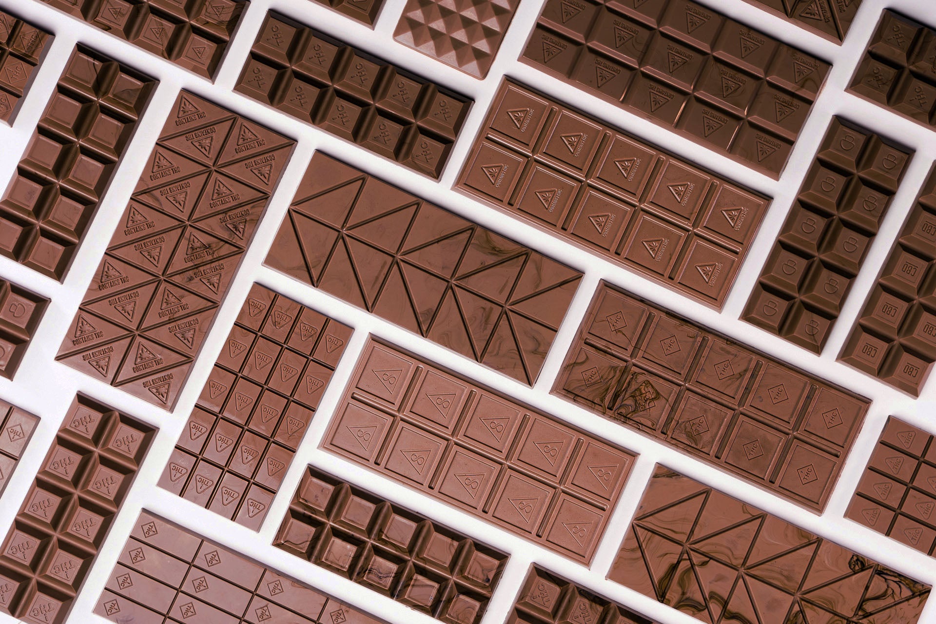an assortment of chocolate bars made from Bold Maker Molds