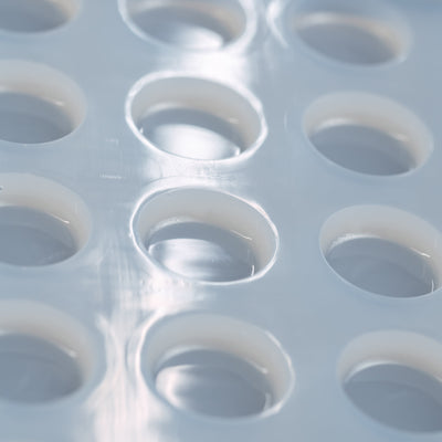 3mLDiscCandyGummyDepositorMoldPlain64Cavities100PercentPlatinumSiliconeCloseUp