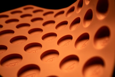 BendingMoldCloseUp3.5mLRoundThinsCandyDepositorMoldMassachusettsMaineRhodeIslandTHCTriangleSymbol40CavitiesInjectionmoldedSiliconeOrange