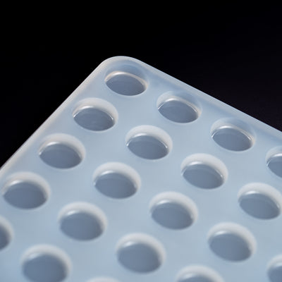 BlackBackground3mLDiscCandyGummyDepositorMoldPlain64Cavities100PercentPlatinumSilicone