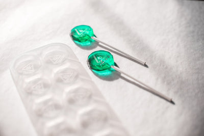 BlueLollipopsWhiteBackground7.5mLLollipopCandyMoldMassachusettsMaineRhodeIslandTHCTriangleSymbol10Cavities100PercentPlatinumSilicone