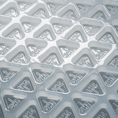 Closeup3mLTriangleCandyGummyDepositorMoldNevadaTHCSymbol135Cavities100PercentPlatinumSilicone