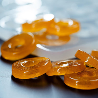 CloseupOrangeGummiesfrom5mLPeachRingCandyGummyDepositorMoldPlain50Cavities100PercentPlatinumSiliconeMoldCorner