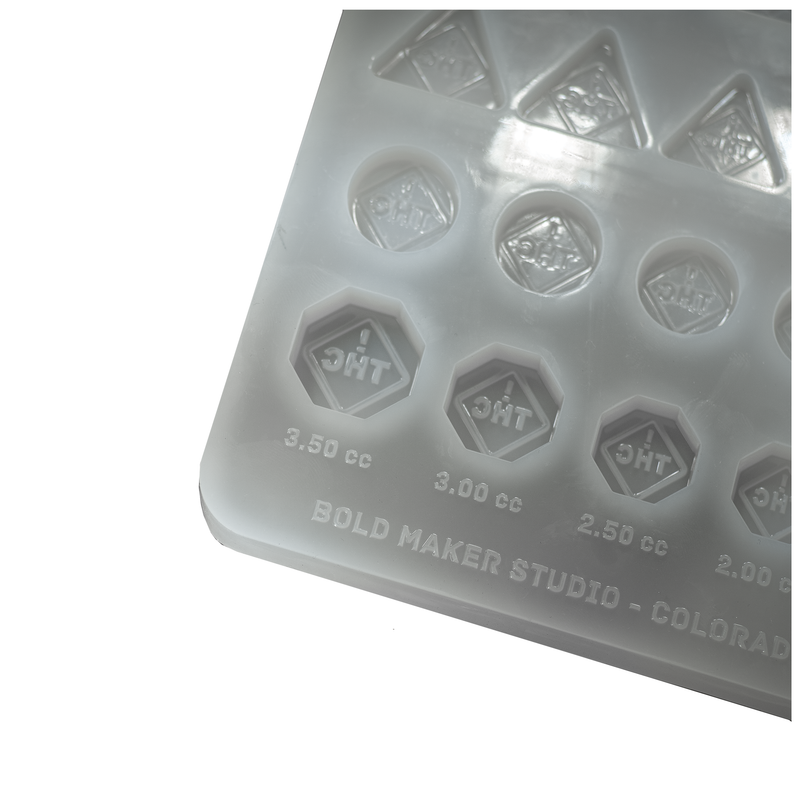 ColoradoTHCSymbolCandyGummyMoldResearchandDevelopmentSampleKitColoradoOhioFlorida100PercentPlatinumSiliconeCornerWhiteBackground
